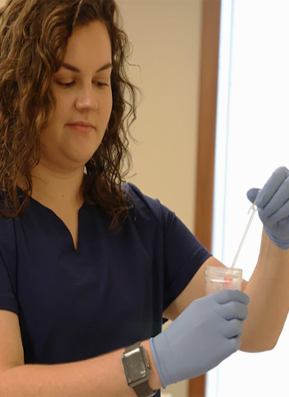 student testing chemicals